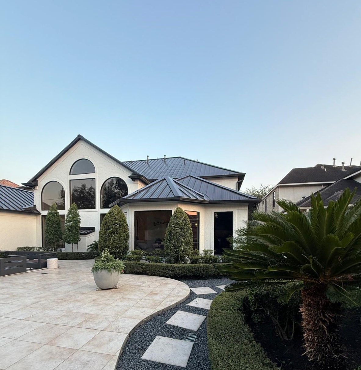 Seamless gutter installation on luxury Houston home — Got Gutterz and Protection